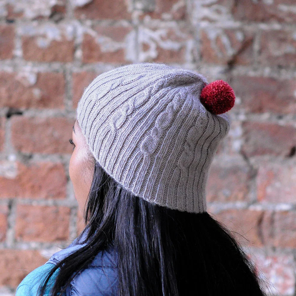 Cable and Rib hat kit by Sarah Hatton and featuring The Fibre Co. yarn, Road to China Light.