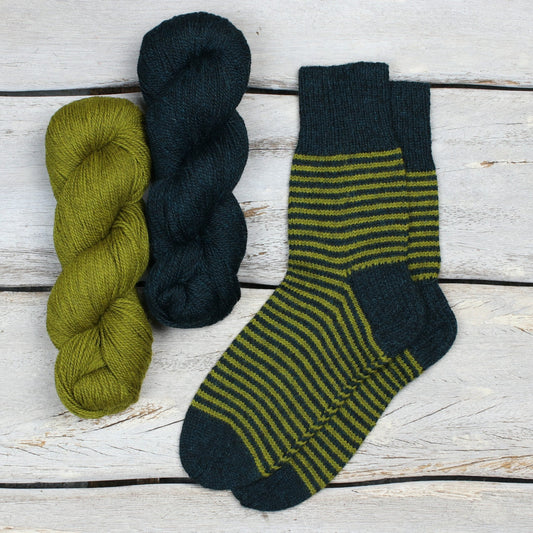 One Sock Striped knitting pattern from Kate Atherley - Learn how to knit socks with the eco-friendly fingering weight yarn Amble from The Fibre Co.