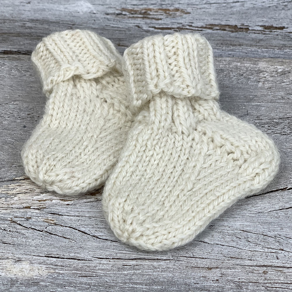 Baby socks knitted in The Fibre Co. eco-friendly sock yarn Amble.